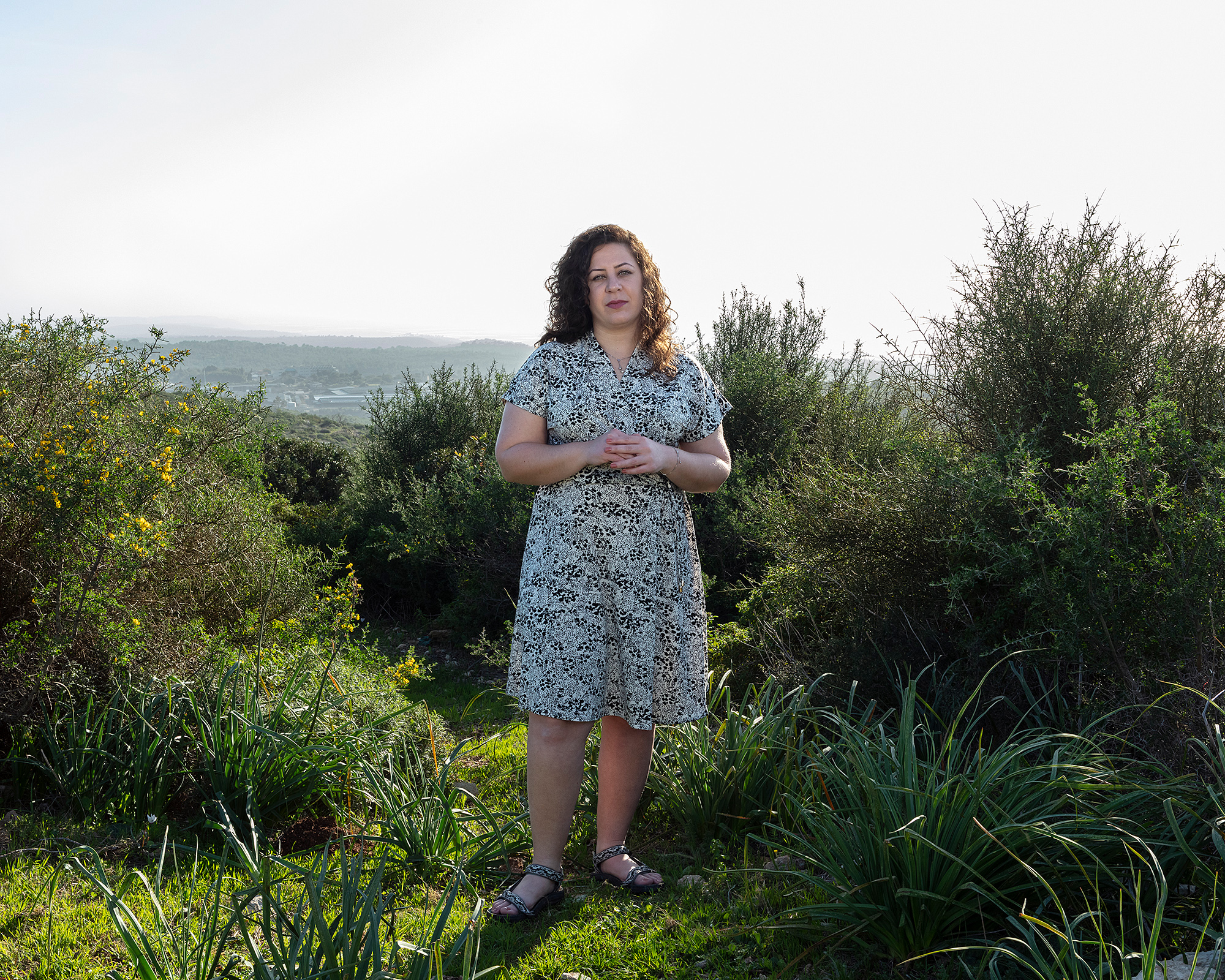 Portrait of young woman standing in nature